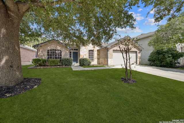 ranch-style home with a garage and a front lawn