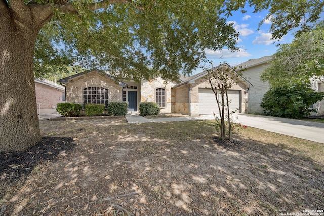 single story home with a garage