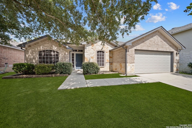 ranch-style house featuring a garage and a front lawn