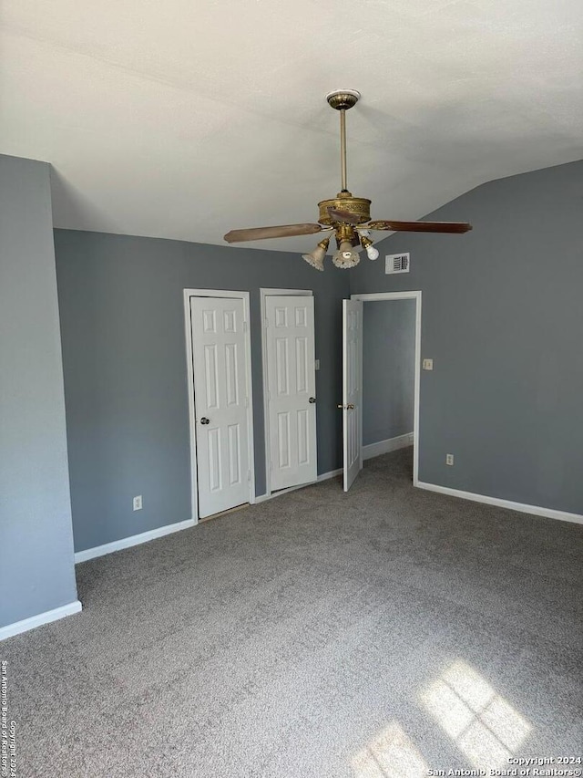 interior space with carpet and ceiling fan