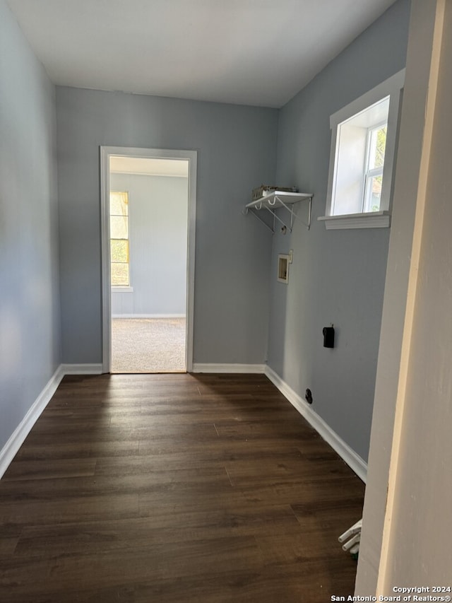 laundry area with dark hardwood / wood-style flooring and washer hookup