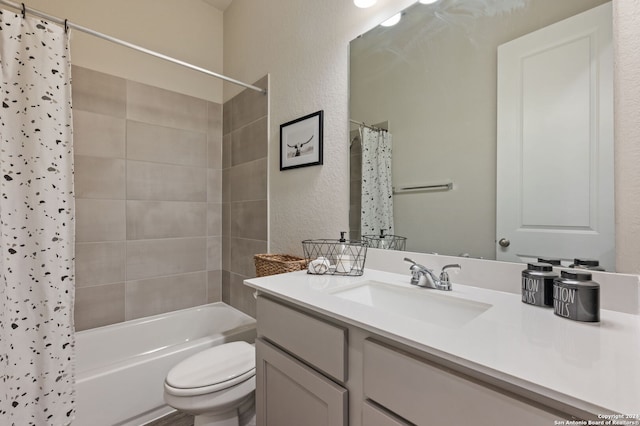 full bathroom featuring toilet, shower / tub combo with curtain, and vanity