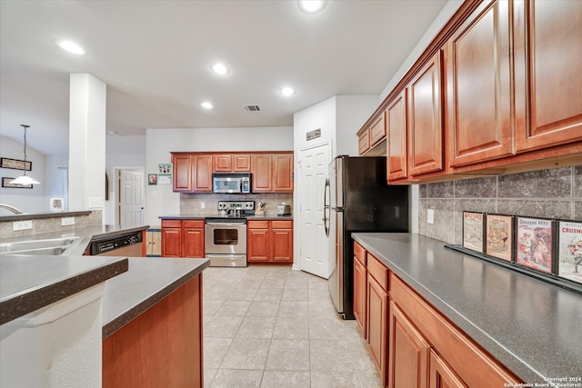 kitchen featuring sink, hanging light fixtures, backsplash, appliances with stainless steel finishes, and light tile patterned floors