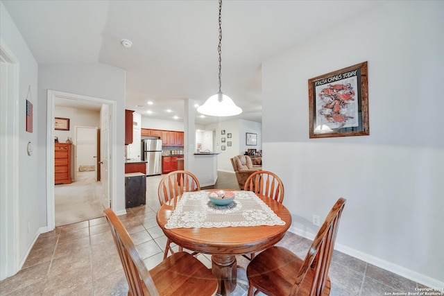 dining space with lofted ceiling