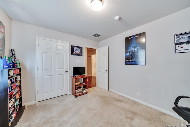 interior space featuring light carpet