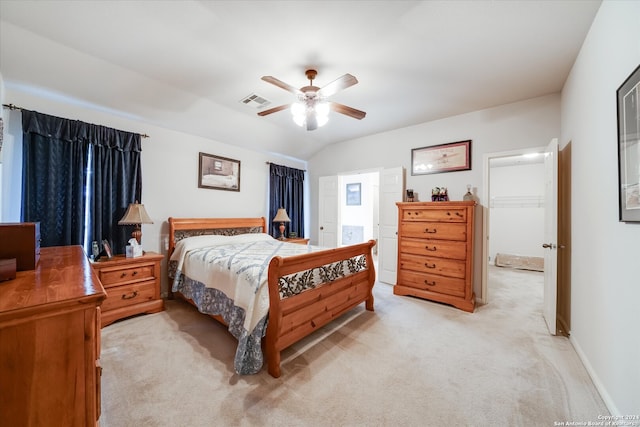 bedroom featuring vaulted ceiling, light carpet, and ceiling fan