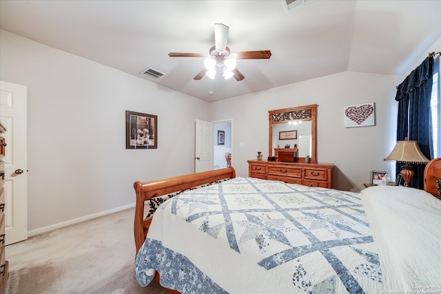 carpeted bedroom featuring lofted ceiling and ceiling fan