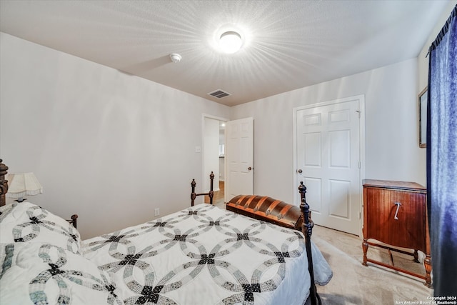 bedroom with light colored carpet