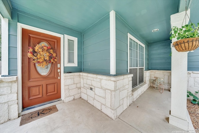 doorway to property featuring a porch