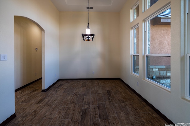 empty room with dark wood-type flooring