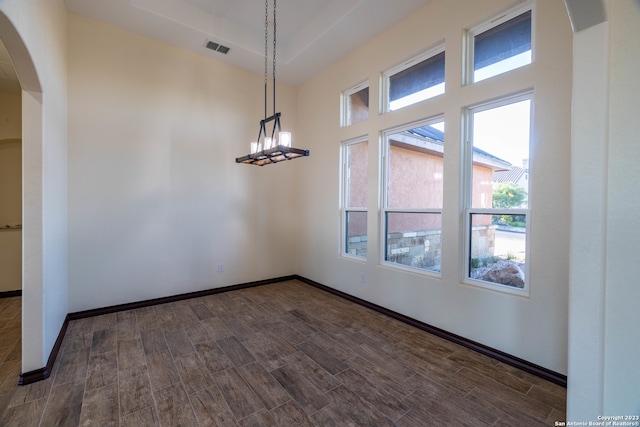 unfurnished room with dark hardwood / wood-style floors