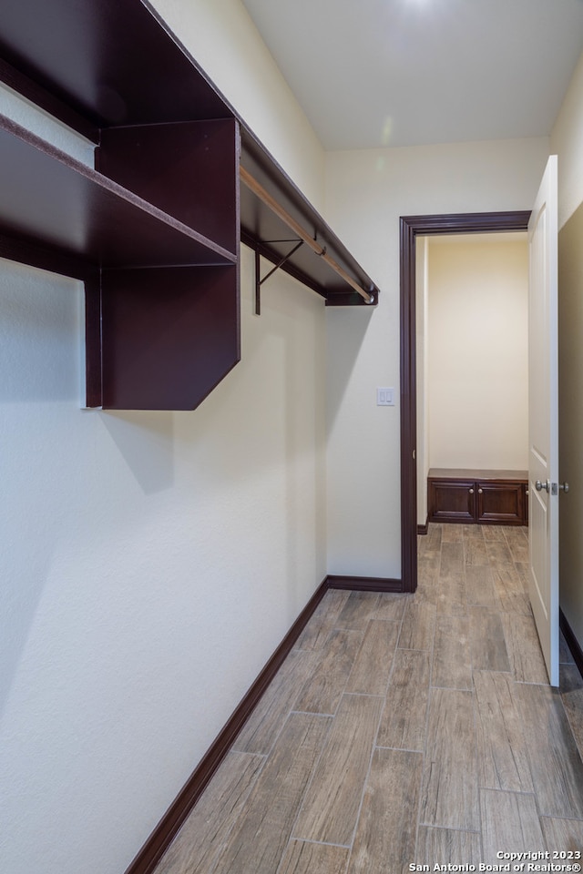 walk in closet featuring light hardwood / wood-style floors