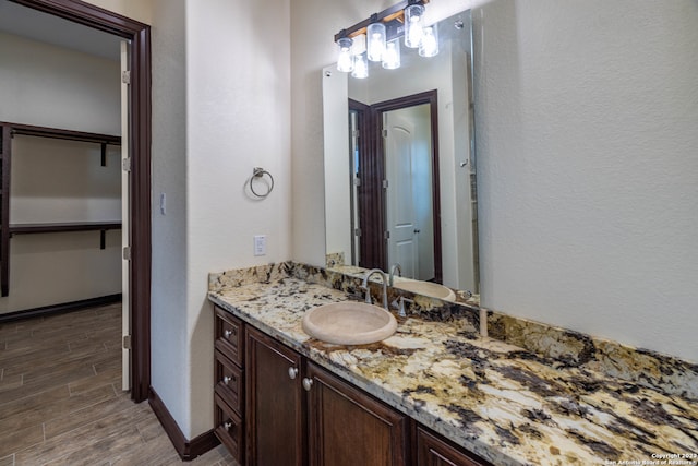 bathroom featuring vanity and hardwood / wood-style floors