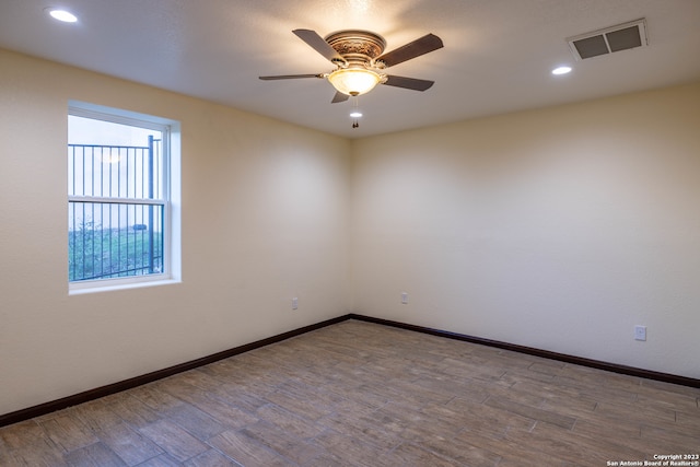 empty room featuring ceiling fan and hardwood / wood-style flooring