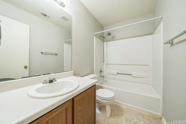 full bathroom featuring  shower combination, vanity, tile patterned flooring, and toilet