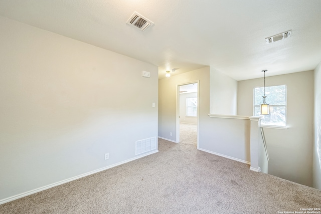 unfurnished room featuring carpet floors