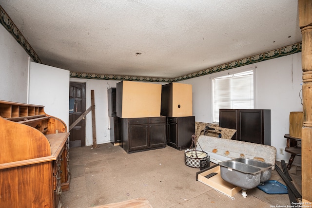 misc room with a textured ceiling