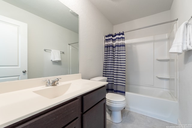 full bathroom with vanity, shower / tub combo, toilet, and tile patterned flooring