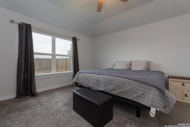 carpeted bedroom with vaulted ceiling and ceiling fan