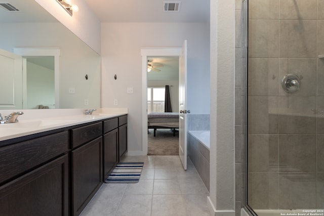 bathroom with tile patterned floors, ceiling fan, independent shower and bath, and vanity