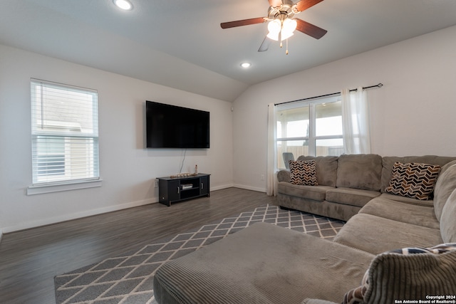 living room featuring lofted ceiling, ceiling fan, and dark hardwood / wood-style floors