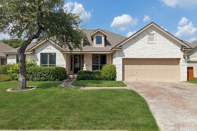 view of front facade with a garage and a front lawn