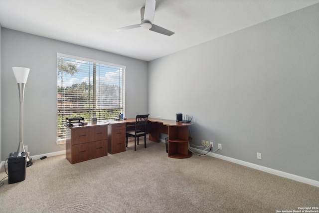 office space featuring ceiling fan and light colored carpet