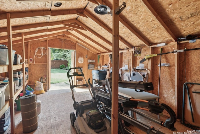 workout room with vaulted ceiling