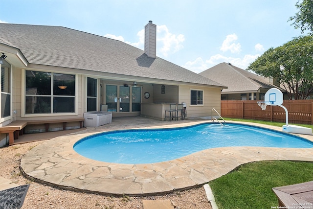 view of swimming pool with a patio