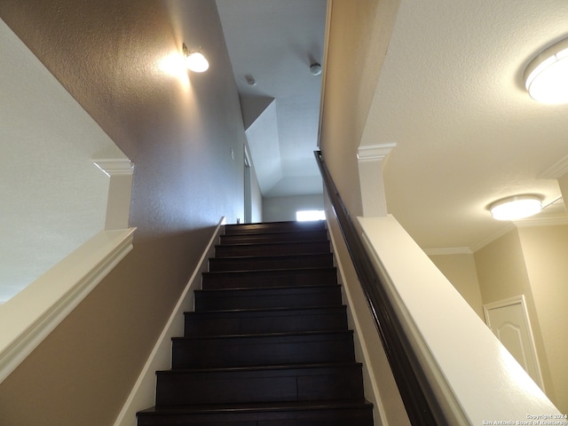 stairs featuring ornamental molding