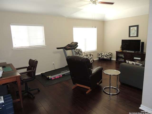 home office featuring dark hardwood / wood-style floors and ceiling fan