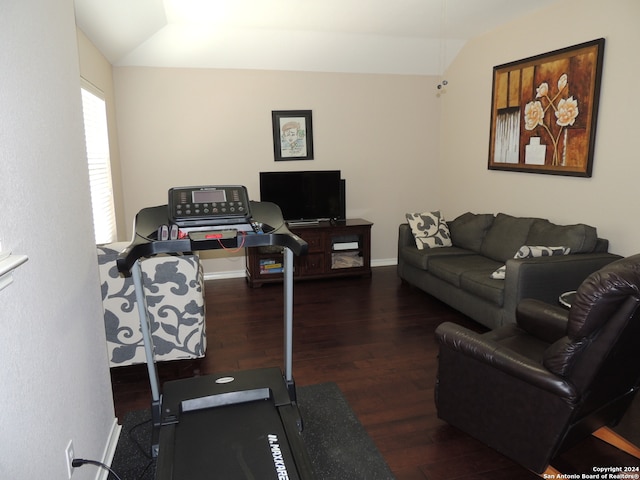 living room with lofted ceiling and dark hardwood / wood-style flooring