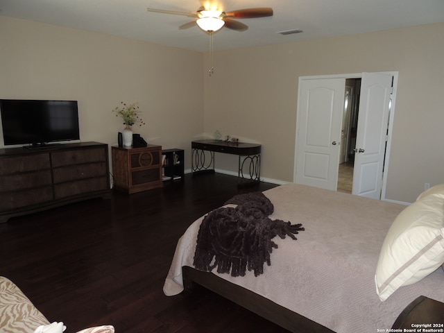 bedroom featuring dark hardwood / wood-style flooring and ceiling fan