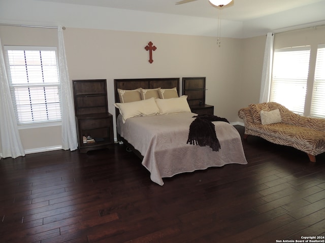 bedroom with ceiling fan and dark hardwood / wood-style flooring