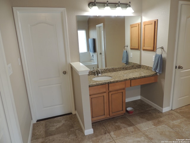 bathroom with tile patterned floors and vanity