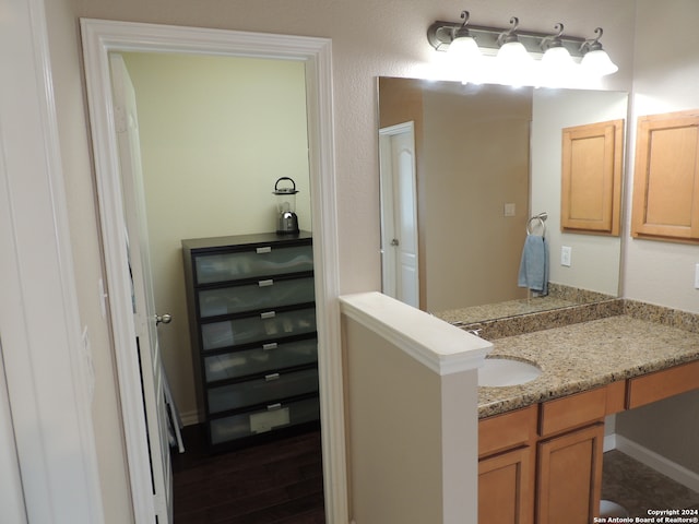 bathroom featuring vanity and hardwood / wood-style floors