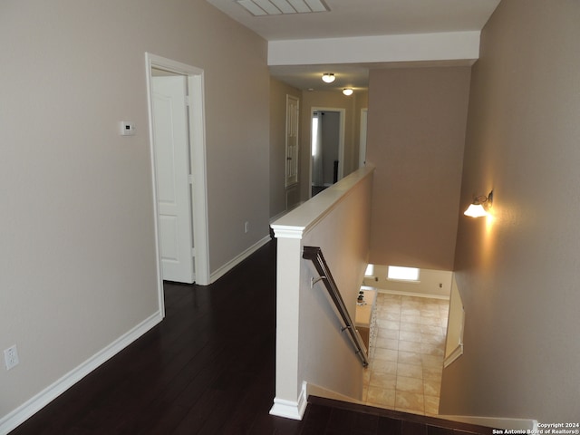 corridor with dark hardwood / wood-style floors