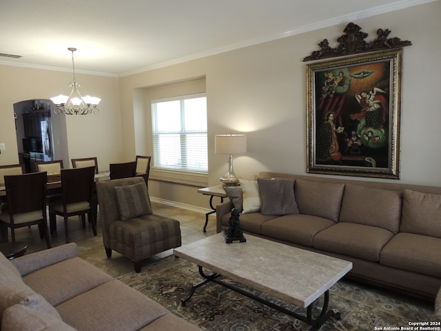 living room with an inviting chandelier and crown molding