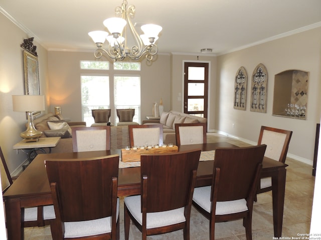 dining room featuring crown molding, a chandelier, and tile patterned floors