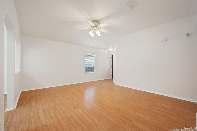 spare room featuring light hardwood / wood-style floors and ceiling fan