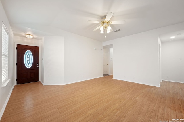 foyer entrance with light hardwood / wood-style floors and ceiling fan