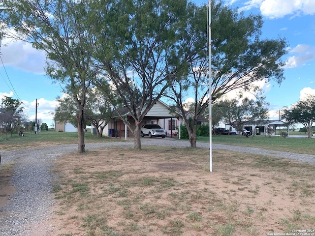 view of front facade with a carport