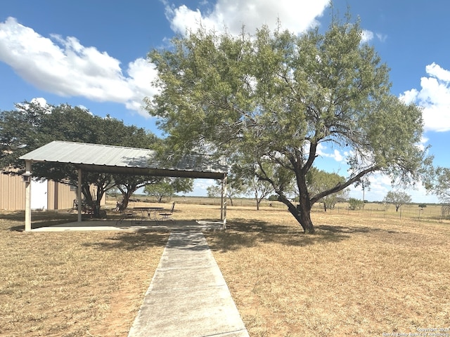 surrounding community featuring a gazebo, a yard, and a rural view