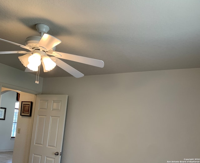 interior details featuring ceiling fan