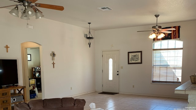 foyer featuring ceiling fan and light tile patterned floors