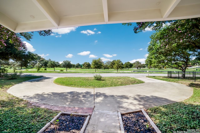 view of home's community featuring a lawn