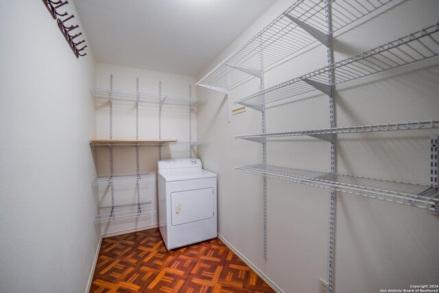 laundry area with washer / clothes dryer and dark parquet floors