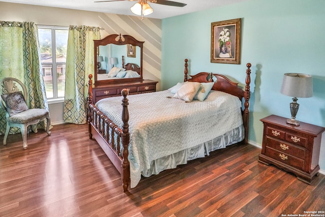 bedroom with ceiling fan and dark hardwood / wood-style floors