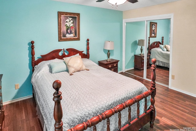 bedroom with dark hardwood / wood-style floors, ceiling fan, and a closet