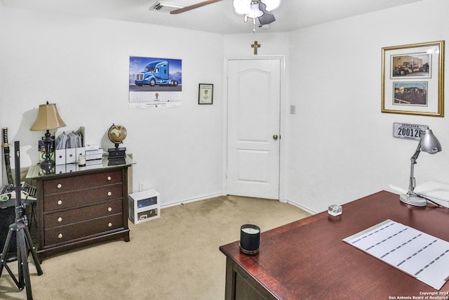 home office featuring ceiling fan and light colored carpet